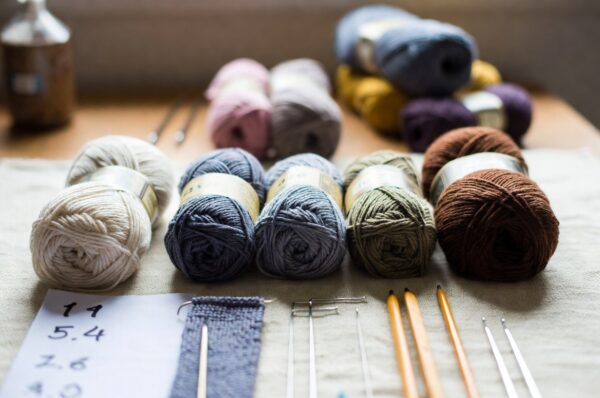 Which Yarn is Best for Crochet? A Complete Guide by Damodaram Enterprise Choosing the right yarn for crochet can make the difference between a frustrating project and a beautiful finished piece. Whether you're a beginner just learning basic stitches or an experienced crocheter working on intricate patterns, understanding yarn types, weights, and characteristics is essential for successful projects. At Damodaram Enterprise, we help crafters across India find the perfect materials for their creative endeavors. Understanding Yarn Basics for Crochet Before diving into specific yarn recommendations, it's important to understand what makes a yarn suitable for crochet. Unlike knitting, crochet creates a denser, more structured fabric, which means your yarn choice affects the final texture, drape, and appearance of your work. The best yarn for crochet depends on several factors including your project type, skill level, desired finish, and personal preferences. However, certain yarn characteristics make crochet work easier and more enjoyable. Yarn Fiber Types: Natural vs Synthetic One of the first decisions you'll face is choosing between natural and synthetic fibers. Each has distinct advantages for different crochet projects. Natural fibers like cotton, wool, and bamboo offer breathability, excellent stitch definition, and a premium feel. Cotton yarn is particularly popular for items like dishcloths, market bags, and summer garments because it's durable, washable, and doesn't stretch excessively. Wool provides warmth and elasticity, making it ideal for winter accessories and blankets. Synthetic fibers such as acrylic and nylon offer affordability, easy care, and consistent quality. For crafters wondering about natural vs synthetic yarn, acrylic is often recommended for beginners because it's forgiving, widely available, and machine washable. This makes it perfect for practice projects and items that will need frequent washing. At Damodaram Enterprise, we offer high-quality nylon threads that work beautifully for crochet jewelry, decorative items, and fine detail work. Our nylon macrame threads are also excellent for structured crochet projects that need durability. Choosing the Right Yarn Weight Yarn weight significantly impacts your crochet project's appearance and the time required to complete it. The Craft Yarn Council has standardized yarn weights from 0 (lace) to 7 (jumbo), making it easier to select appropriate materials. For beginners, medium weight yarns (worsted weight or category 4) are ideal. They're thick enough to see your stitches clearly, work up quickly, and are forgiving of tension inconsistencies. This weight is versatile for afghans, scarves, hats, and amigurumi. Fine weight yarns (categories 0-2) are better suited for experienced crocheters working on delicate shawls, doilies, or intricate lacework. These require more precision and patience but create beautiful, delicate results. Bulky and super bulky yarns (categories 5-7) are perfect for quick projects like chunky blankets, rugs, and oversized scarves. They work up fast and create cozy, textured pieces. Understanding how to read yarn labels helps you make informed choices. Our guide on how to read yarn labels explains everything you need to know before purchasing materials for your next project. Best Yarn Characteristics for Crochet Certain yarn properties make crochet work more enjoyable and produce better results. Look for these characteristics when selecting yarn: Smooth texture allows your hook to glide easily through stitches, reducing hand fatigue and creating even tension. Highly textured or fuzzy yarns can obscure your stitches, making it difficult to see where to insert your hook. Good stitch definition means you can clearly see each individual stitch in your finished work. This is particularly important for textured stitches and intricate patterns. Tightly plied yarns generally show stitch definition better than loosely spun options. Consistent thickness throughout the skein ensures your finished piece has uniform tension and appearance. Quality yarns from reliable suppliers like Damodaram Enterprise maintain consistent diameter and twist. Appropriate drape for your project matters too. A structured bag needs yarn that holds its shape, while a flowing shawl requires yarn with good drape. Consider your end use when selecting yarn. Recommended Yarns for Different Crochet Projects Different projects demand different yarn qualities. Here are recommendations for common crochet items: For wearables like sweaters, cardigans, and tops, choose soft, comfortable yarns with good drape. Cotton blends work well for summer garments, while wool or acrylic are better for cooler weather items. Consider how the finished garment will be washed and cared for. Home decor items including blankets, pillows, and rugs need durable, easy-care yarns. Acrylic is excellent for blankets that will be washed frequently. For decorative pieces, you might choose more luxurious fibers. Amigurumi and stuffed toys require yarn that creates a tight fabric to prevent stuffing from showing through. Cotton and acrylic in worsted weight are popular choices. The yarn should also be washable if the toy is intended for children. Jewelry and accessories benefit from specialty threads. At Damodaram Enterprise, our 1mm nylon macrame thread and 2mm nylon threads are perfect for creating delicate crochet jewelry, bookmarks, and decorative elements. Color Considerations Yarn color affects both the appearance of your finished project and the ease of working with it. Light colored yarns make it easier to see your stitches, which is why white, cream, or pale yellow are often recommended for beginners learning new techniques. Dark colors like black, navy, and deep purple can be challenging to work with because stitches are harder to distinguish. However, they create striking finished pieces and hide dirt better for practical items. Variegated and self-striping yarns create interesting color patterns without changing yarns. They work well for simple stitch patterns but can overwhelm complex textured stitches. Understanding why colors look different on different screens helps when ordering yarn online. Multi-colored techniques like planned pooling allow creative color work. Learn more about what is planned pooling to create intentional color patterns in your crochet. Estimating Yarn Quantity Running out of yarn mid-project is frustrating, while buying too much wastes money. Learning how to estimate yarn quantity for any project ensures you purchase the right amount. Factors affecting yarn requirements include project size, stitch pattern, yarn weight, and your personal tension. Patterns typically specify required yardage, but if you're designing your own piece or substituting yarns, you'll need to calculate quantities yourself. Special Considerations for Indian Climate In India's diverse climate, yarn choice should consider local weather conditions. Cotton and cotton blends are excellent for hot, humid regions, offering breathability and comfort. These natural fibers absorb moisture and keep you cool. For cooler regions or winter projects, wool blends provide warmth without excessive bulk. Acrylic is a practical choice year-round because it's affordable, washable, and widely available across India. Why Choose Damodaram Enterprise for Your Crochet Supplies At Damodaram Enterprise, we understand the needs of Indian crafters. We offer premium quality threads and cords suitable for various crochet applications, from delicate jewelry to sturdy home decor items. Our extensive range includes nylon macrame threads in multiple thicknesses and colors, elastic threads for stretch projects, and specialty cords for unique applications. We're committed to providing consistent quality at competitive prices. For crafters seeking guidance on selecting materials, our blog offers comprehensive resources on how to choose the right yarn for your crochet and knitting projects in India. Conclusion The best yarn for crochet depends on your specific project, skill level, and personal preferences. Consider fiber content, weight, texture, and color when making your selection. Quality materials from trusted suppliers like Damodaram Enterprise ensure your crochet projects turn out beautifully and stand the test of time. Whether you're creating delicate jewelry with fine nylon thread or working on a cozy blanket with bulky yarn, choosing appropriate materials sets you up for success. Experiment with different yarn types to discover your favorites, and don't hesitate to seek guidance from experienced crafters and quality suppliers. Start your next crochet project with confidence by selecting the perfect yarn for your needs. Visit Damodaram Enterprise for premium quality threads, cords, and helpful guidance to bring your creative vision to life.